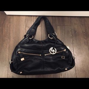 Michael Kors Purse. Black with gold hardwear.
